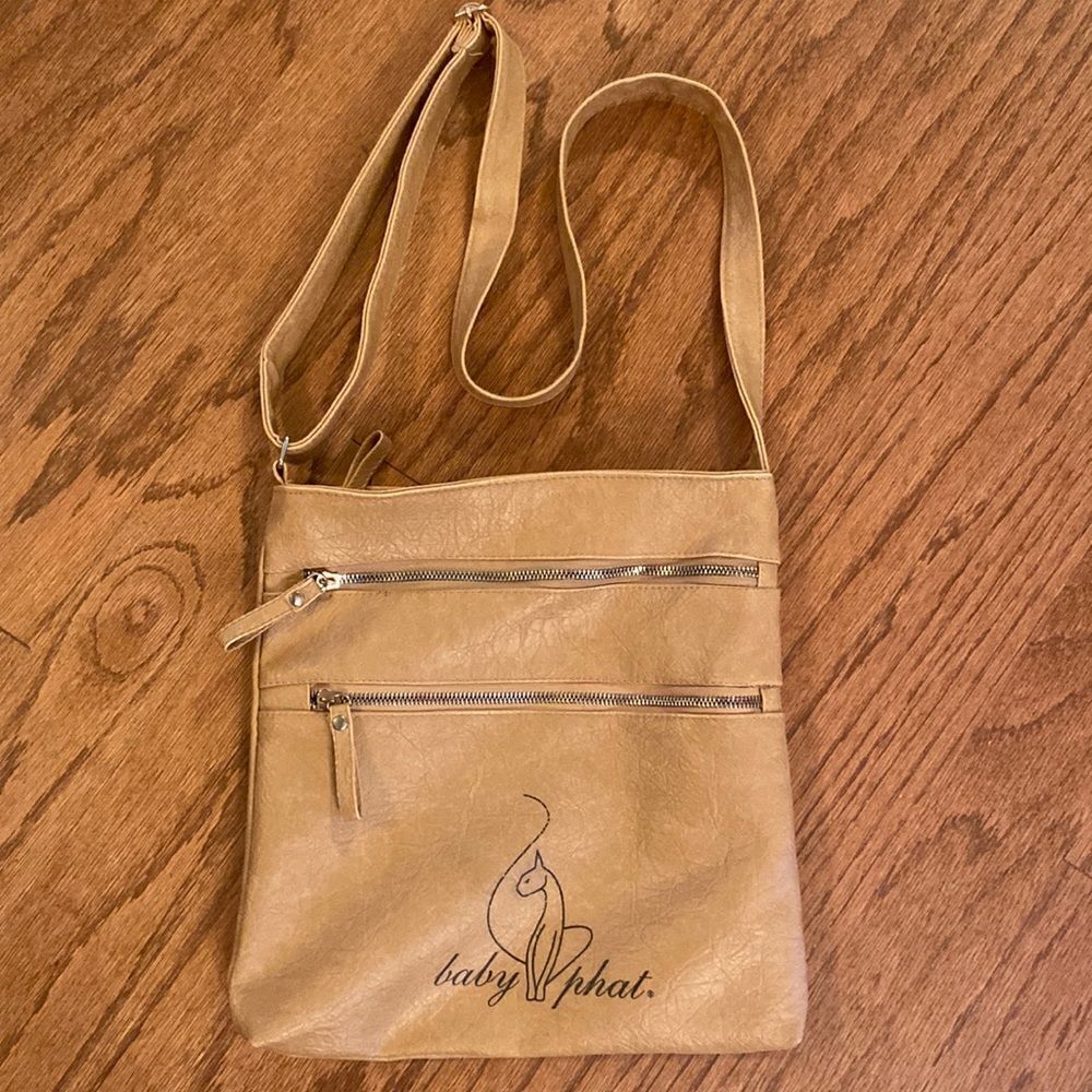 Baby Phat bag tan colored black writing on it cross body or shoulder